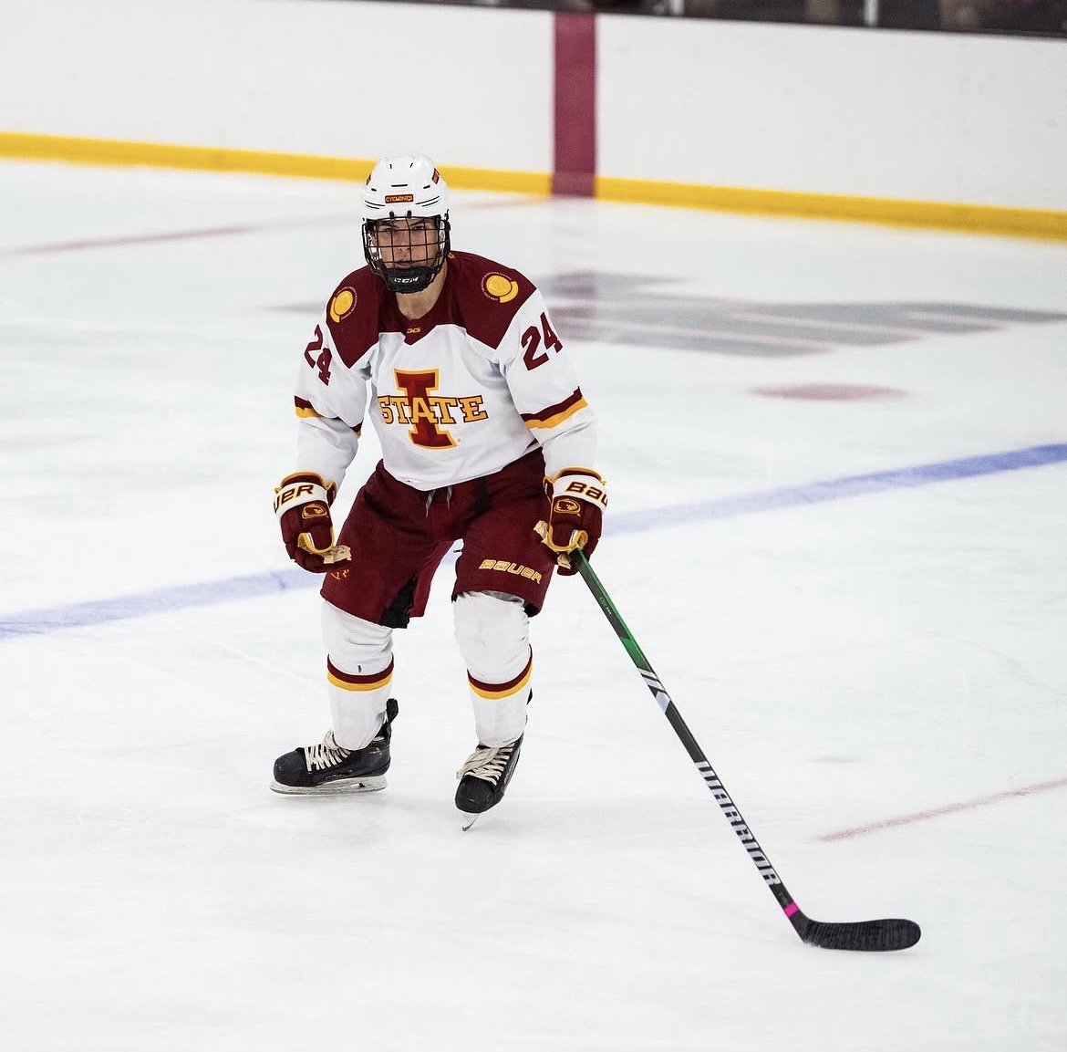 Ethan playing hockey for Iowa State University